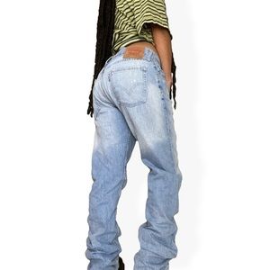 514 faded paint stained jeans by Levi’s